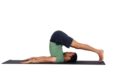 Image of person doing yoga in halasana - plough pose.